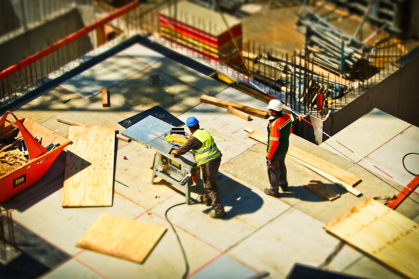 Construction workers reviewing plans on site